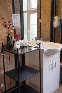 a bathroom with a sink and a mirror at 72QT in London