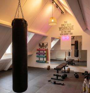 a room with a gym with a punching bag at MG Suites & Infinity in Ravels