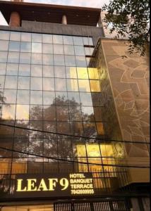 a building with a sign on the side of it at Leaf 9 Imperial, Subhash Nagar, Pacific Mall in New Delhi