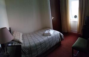 Postel nebo postele na pokoji v ubytování Town Apartments Aberdeen