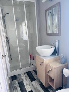 a bathroom with a sink and a shower at Blairgowrie in Ballintuim +9 photos