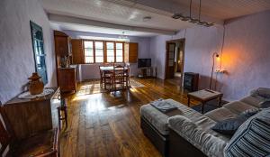a living room with a couch and a table at Casa Laureano in Carcedo