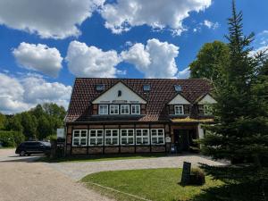 a building with a car parked in front of it at Die Grenzburg in Güstrow