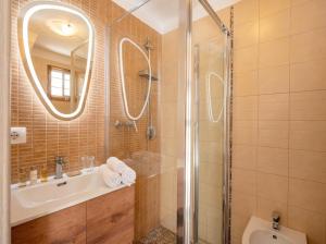 a bathroom with a shower and a sink and a mirror at Casa Tino - Retreat by the Sea and History in Polignano a Mare