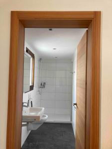 a bathroom with a sink and a toilet and a mirror at Sole Mountain apartement in Zermatt +27 photos