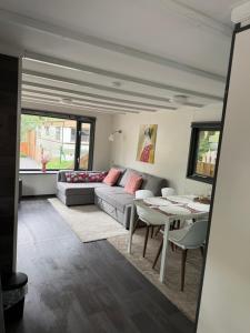 a living room with a couch and a table at Chalet Wismar in Rijen
