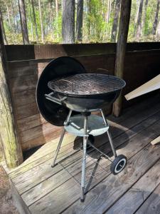 a grill sitting on top of a wooden deck at Byron in Rälla