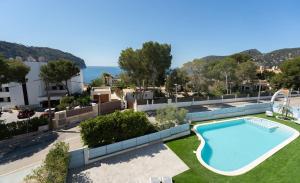 an image of a swimming pool at a resort at DOLS MAR APARTMENTS in Camp de Mar