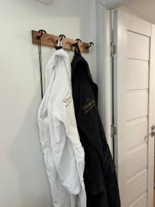 a group of jackets hanging on a rack at Virajlux in Dâmbovicioara
