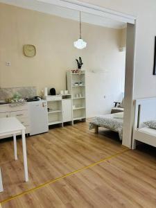 a living room with a yellow line on the floor at House1890 in Kula