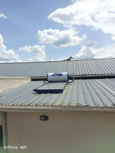 a satellite on the roof of a building at Laker's barn in Gulu