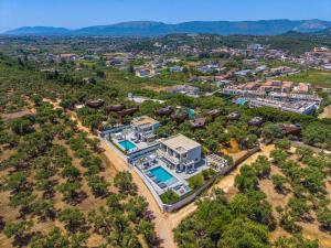 an aerial view of a house with a swimming pool at Christian Luxury Villa in Tsilivi