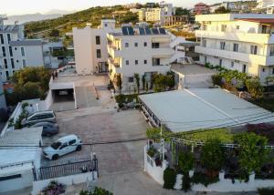 an aerial view of a city with buildings at Poseidon Family Hotel Ksamil in Ksamil