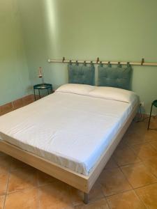 a large bed in a room with two tables at Roma country resort in Rome +15 photos