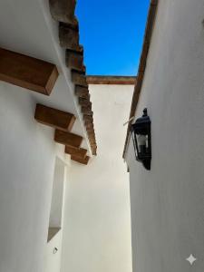 a view of the sky from the inside of a white building at Casa Vicen in Bolbaite +36 photos