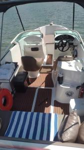 a boat with a toilet on the deck at Lancha melodia in Paraty