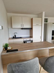 a kitchen with a large wooden counter top at Offline by Alexa in Lahnstein