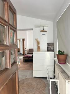 a living room with a dresser and a couch at Modern apartment with space for 6 in Weißenfels