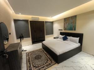 a bedroom with a bed and a television in it at House 234 in Ungwan Bado