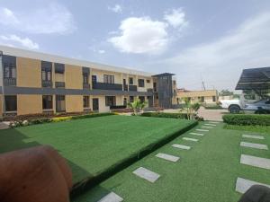 a building with a lawn in front of it at House 234 in Ungwan Bado