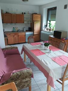 a kitchen with a table with two chairs and a table sidx sidx sidx at Chalet Sedmihori in Staré Sedlo