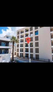 a red heart sign in front of a building at Seaside Premium Apartments Bar - Susanj in Bar