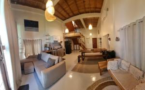 a living room with a couch and a table at Valhalla Mentawai in Katiet