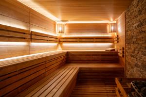 a sauna is shown with wooden panels and lights at Rezort Gothal Chalupy in Donovaly