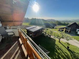 a balcony with a view of a yard with trees at Ferienwohnung Silvia in Sankt Kanzian