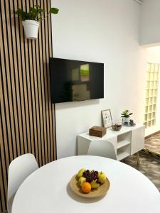 a room with a table with a plate of fruit on it at Casa Agustina in Arguineguín