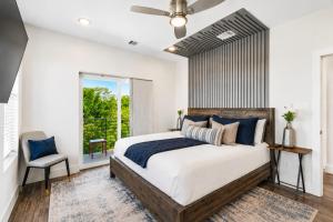 a bedroom with a large bed and a window at The Ultimate View House in Dallas