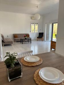 a living room with a table with two plates on it at Modern Villa in Lesvos in Apidias Lakos