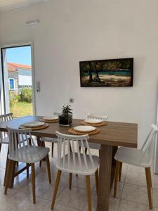 a dining room with a wooden table and chairs at Modern Villa in Lesvos in Apidias Lakos