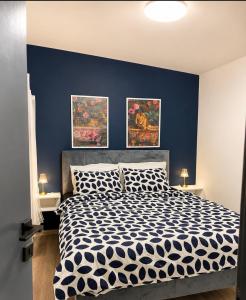 a bedroom with a blue accent wall and a bed at Villa Pantheon Mostar in Blagaj +12 photos