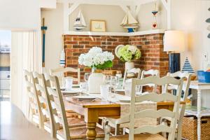 a dining room with a table and chairs at Mimi's Beach House Beach Access in Wells