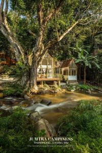 a house in the middle of a river at The ForRest Peace Forest แม่กำปอง in Ban Huai Kaeo +69 photos