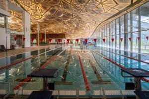 a large swimming pool in a large building at Rezort Gothal Chalupy in Donovaly
