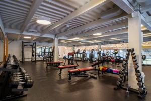 a gym with a bunch of equipment in it at Rezort Gothal Chalupy in Donovaly +76 photos
