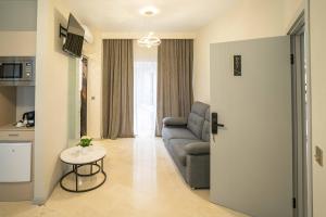 a living room with a couch and a table at Casa Luxore in Alicante