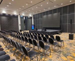 a conference room with chairs and a screen at Azahar Hotel & Spa in San Pedro +43 photos