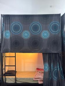 a bed with a canopy in a room at Manavi Hostel Near by Mathura Railway Station in Mathura +40 photos