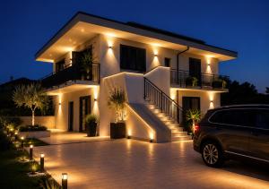 a car parked in front of a house at night at Reale Guest House in Mascalucia