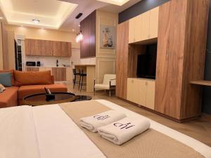 a room with a bed and a living room at Ya Bayté in Beirut