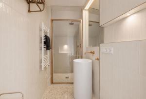 a bathroom with a shower and a toilet in it at Oyster Loft Ostend in Ostend