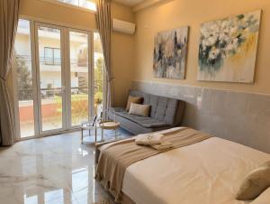 a bedroom with a bed and a couch at Ya Bayté in Beirut
