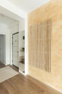 a room with a wooden wall with a mirror at Bitola Stay in Bitola