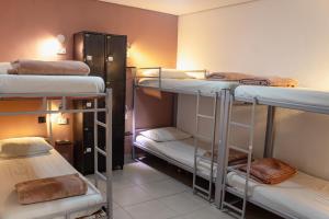 a room with four bunk beds in a room at Soul Hostel Av Paulista Bela Vista 1 in São Paulo