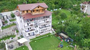 an overhead view of a large house with a yard at Vila Tigani in Peje