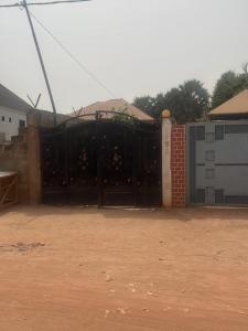 a black gate in front of a building at Sumanya guest house 3 in Sukuta