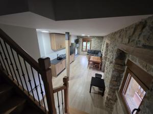 an overhead view of a living room with a stone fireplace at Alojamientos ADRIMAR in Arnuero